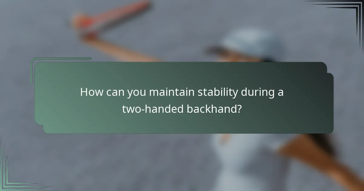 How can you maintain stability during a two-handed backhand?